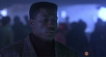 Movie still from “Jungle Fever” (1991), directed by Spike Lee – A person wearing a jacket; Close Up shot, Low angle