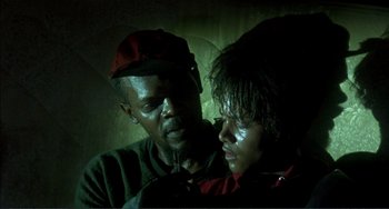 Movie still from “Jungle Fever” (1991), directed by Spike Lee – A man and a woman are looking at one another; Close Up shot, Over the shoulder angle