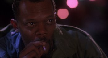 Movie still from “Jungle Fever” (1991), directed by Spike Lee – A person with a cigarette in his mouth; Close Up shot, Low angle