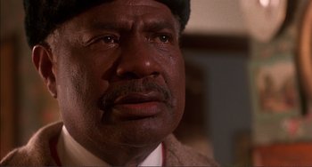 Movie still from “Jungle Fever” (1991), directed by Spike Lee – An older man with a beard and a hat on; Close Up shot, Low angle
