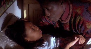 Movie still from “Jungle Fever” (1991), directed by Spike Lee – A man and a little girl looking at each other; Close Up shot, High angle
