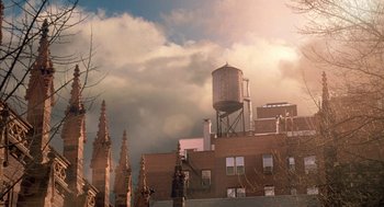 Movie still from “Just My Luck” (2006), directed by Donald Petrie – A building that has a water tower on top of it; Extreme Wide shot, Low angle
