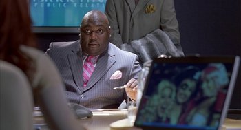 Movie still from “Just My Luck” (2006), directed by Donald Petrie – A man sitting at a table in front of a computer; Close Up shot, Over the shoulder angle