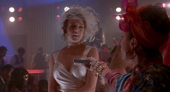 Movie still from “Just My Luck” (2006), directed by Donald Petrie – A woman in a white dress holding a cell phone in her hand; Close Up shot, Over the shoulder angle