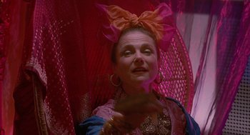 Movie still from “Just My Luck” (2006), directed by Donald Petrie – A woman with a big pink bow on her head; Close Up shot, Low angle