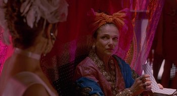 Movie still from “Just My Luck” (2006), directed by Donald Petrie – A woman with a turban sitting in front of a mirror; Close Up shot, Over the shoulder angle