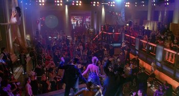 Movie still from “Just My Luck” (2006), directed by Donald Petrie – A group of people dancing in front of an audience; Extreme Wide shot, High angle