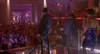 Movie still from “Just My Luck” (2006), directed by Donald Petrie – A group of men in suits and hats on a dance floor; Wide shot, High angle