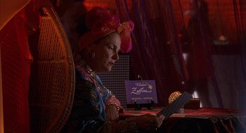 Movie still from “Just My Luck” (2006), directed by Donald Petrie – An older woman sitting at a table looking at a menu; Medium shot, Over the shoulder angle