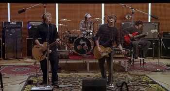 Movie still from “Just My Luck” (2006), directed by Donald Petrie – A group of people that are in a recording studio; Wide shot, High angle