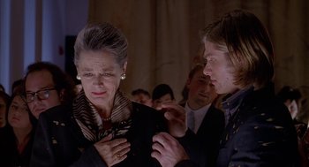 Movie still from “Just My Luck” (2006), directed by Donald Petrie – An older woman and a younger man in a crowd; Close Up shot, Low angle