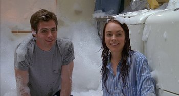 Movie still from “Just My Luck” (2006), directed by Donald Petrie – A man and a woman are sitting in the foam; Medium shot, Over the shoulder angle
