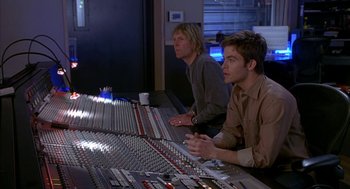 Movie still from “Just My Luck” (2006), directed by Donald Petrie – Two men sitting in front of a sound board; Medium shot, High angle