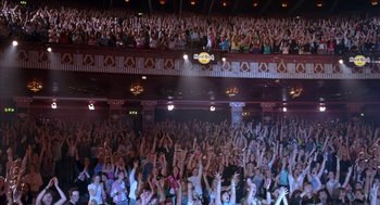 Movie still from “Just My Luck” (2006), directed by Donald Petrie – A large crowd of people in a large auditorium; Extreme Wide shot, High angle