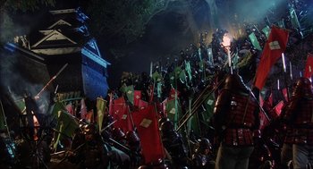 Movie still from “Kagemusha” (1980), directed by Akira Kurosawa – A group of people dressed in medieval armor; Extreme Wide shot, High angle