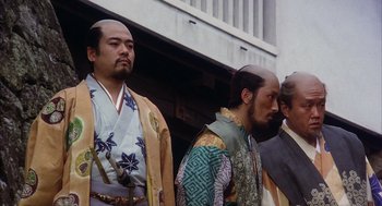 Movie still from “Kagemusha” (1980), directed by Akira Kurosawa – A group of men standing next to each other; Medium shot, Low angle
