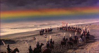 Movie still from “Kagemusha” (1980), directed by Akira Kurosawa – A group of people riding horses on top of a sandy beach; Extreme Wide shot, High angle