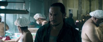 Movie still from “Keanu” (2016), directed by Peter Atencio – A person wearing a hat; Close Up shot, Over the shoulder angle