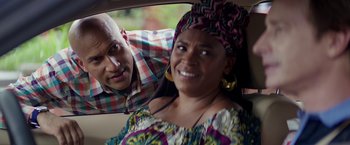 Movie still from “Keanu” (2016), directed by Peter Atencio – A man and a woman in the back seat of a car; Close Up shot, Over the shoulder angle