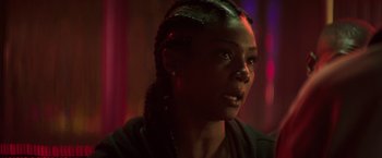 Movie still from “Keanu” (2016), directed by Peter Atencio – A person wearing a black shirt; Close Up shot, Over the shoulder angle