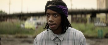 Movie still from “Keanu” (2016), directed by Peter Atencio – A person with dreadlocks; Close Up shot, Low angle