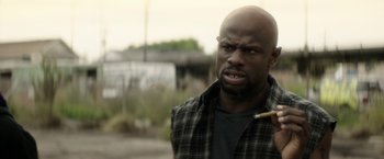 Movie still from “Keanu” (2016), directed by Peter Atencio – A man with a cigarette in his mouth; Close Up shot, Low angle