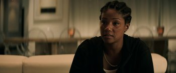 Movie still from “Keanu” (2016), directed by Peter Atencio – A person sitting on a couch; Close Up shot, Over the shoulder angle