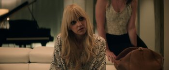 Movie still from “Keanu” (2016), directed by Peter Atencio – A woman with long blonde hair sitting in front of a mirror; Close Up shot, Over the shoulder angle