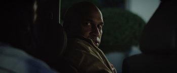 Movie still from “Keanu” (2016), directed by Peter Atencio – A man sitting in a car at night looking into the distance; Close Up shot, Over the shoulder angle