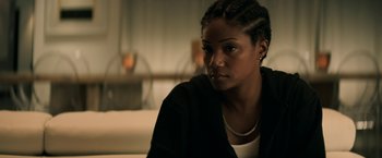 Movie still from “Keanu” (2016), directed by Peter Atencio – A woman sitting in front of a window looking at the camera; Close Up shot, Over the shoulder angle