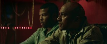 Movie still from “Keanu” (2016), directed by Peter Atencio – A couple of men sitting next to each other in a room; Close Up shot, Over the shoulder angle