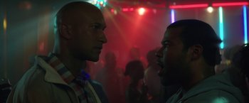 Movie still from “Keanu” (2016), directed by Peter Atencio – Two men are facing each other in a party; Close Up shot, Over the shoulder angle