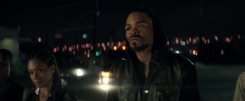 Movie still from “Keanu” (2016), directed by Peter Atencio – A man in a leather jacket looking at the camera; Close Up shot, Over the shoulder angle