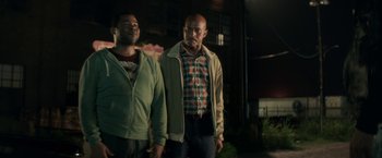 Movie still from “Keanu” (2016), directed by Peter Atencio – A couple of men standing next to each other; Medium shot, Over the shoulder angle