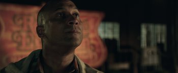 Movie still from “Keanu” (2016), directed by Peter Atencio – A person looking up at something; Close Up shot, Low angle