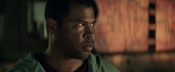 Movie still from “Keanu” (2016), directed by Peter Atencio – A person looking at the camera; Close Up shot, Over the shoulder angle