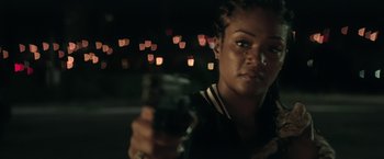 Movie still from “Keanu” (2016), directed by Peter Atencio – A woman holding a cell phone in her hand; Close Up shot, Over the shoulder angle