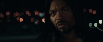 Movie still from “Keanu” (2016), directed by Peter Atencio – A person wearing a hooded sweatshirt; Close Up shot, Over the shoulder angle
