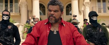 Movie still from “Keanu” (2016), directed by Peter Atencio – A person wearing a red shirt; Close Up shot, Low angle