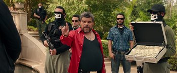 Movie still from “Keanu” (2016), directed by Peter Atencio – A group of men standing next to each other on a street; Medium shot, Over the shoulder angle