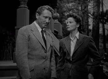 Movie still from “Keeper of the Flame” (1942), directed by George Cukor – An older man and a younger woman standing next to each other; Medium shot, Low angle