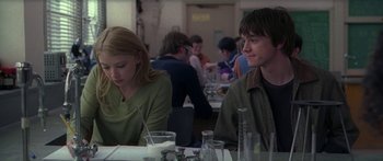 A man and a woman sitting at a table in a restaurant