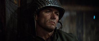 Movie still from “Kelly's Heroes” (1970), directed by Brian G. Hutton – A person wearing a helmet; Close Up shot, Low angle