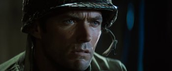 Movie still from “Kelly's Heroes” (1970), directed by Brian G. Hutton – A person wearing a helmet; Close Up shot, Low angle
