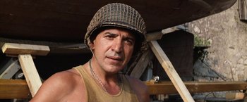 Movie still from “Kelly's Heroes” (1970), directed by Brian G. Hutton – A person wearing a helmet; Close Up shot, Low angle