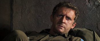 Movie still from “Kelly's Heroes” (1970), directed by Brian G. Hutton – A person wearing a shirt; Close Up shot, High angle