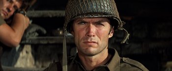 Movie still from “Kelly's Heroes” (1970), directed by Brian G. Hutton – A person wearing a helmet; Close Up shot, Low angle