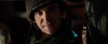 Movie still from “Kelly's Heroes” (1970), directed by Brian G. Hutton – A person wearing a hat; Close Up shot, Low angle