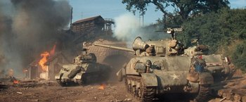 Movie still from “Kelly's Heroes” (1970), directed by Brian G. Hutton – A couple of tanks that are in the dirt; Wide shot, High angle
