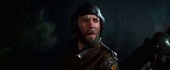 Movie still from “Kelly's Heroes” (1970), directed by Brian G. Hutton – A man with a beard wearing a leather jacket; Close Up shot, Low angle